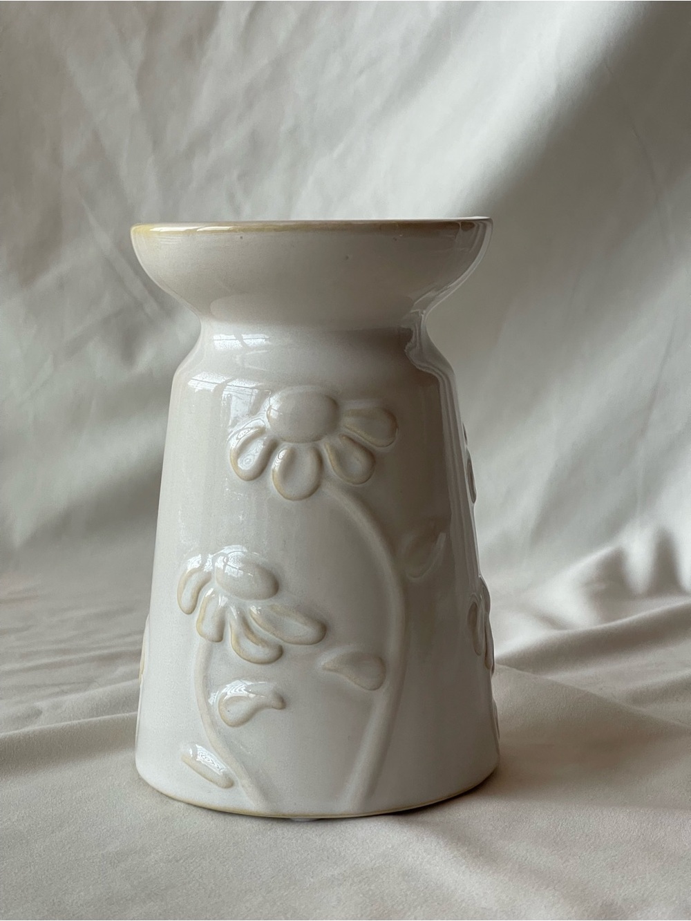 White Ceramic Candle Holder with Embossed Flower Accents